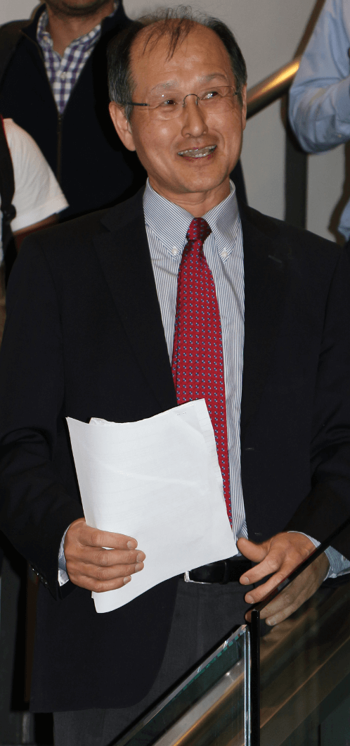 Photo of Insup Lee speaking on stairs at an event